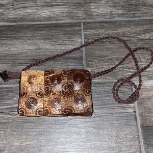 Wood/brown little purse over shoulder